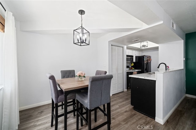3051 Knollwood Ave, La Verne, CA 91750 - dining area featuring dark wood-style flooring and a chandelier