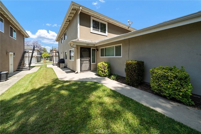3051 Knollwood Ave, La Verne, CA 91750 - back of property with stairs, stucco siding, and a yard