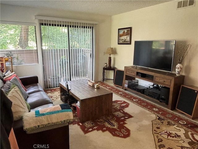 22840 Hilton Head Unit 129, Diamond Bar, CA 91765 - carpeted living room featuring a textured ceiling