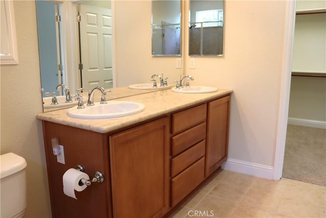 1573 Maple Valley St, Manteca, CA 95336 - full bath with double vanity and tile patterned flooring