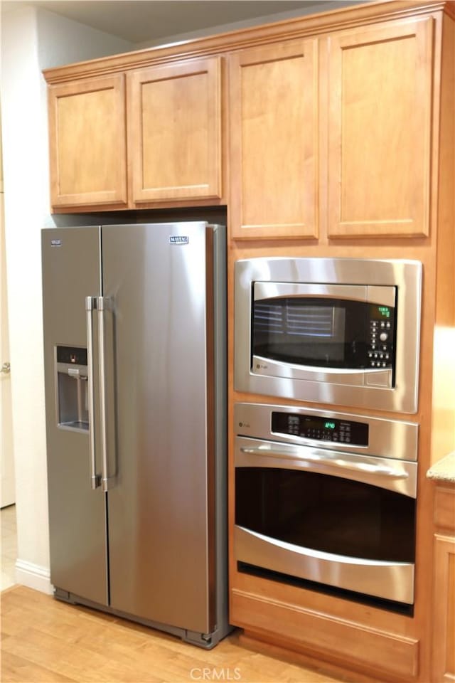 1573 Maple Valley St, Manteca, CA 95336 - kitchen featuring stainless steel appliances and light wood-style flooring