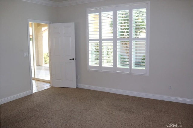 1573 Maple Valley St, Manteca, CA 95336 - empty room featuring light colored carpet, crown molding, and plenty of natural light
