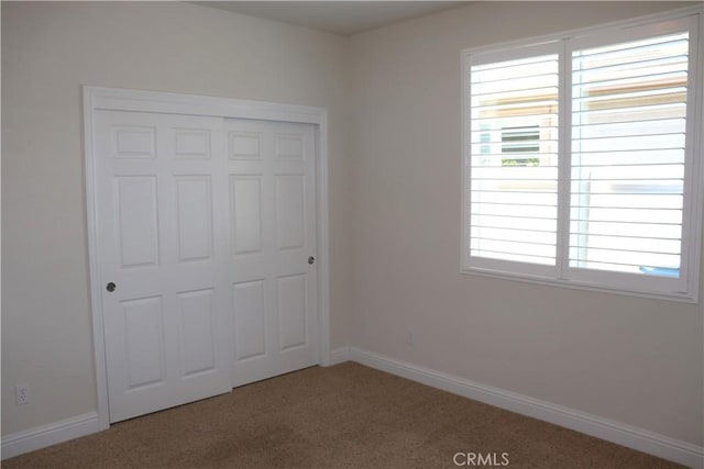 1573 Maple Valley St, Manteca, CA 95336 - unfurnished bedroom with carpet flooring, multiple windows, and a closet