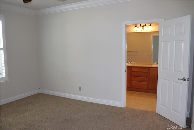 1573 Maple Valley St, Manteca, CA 95336 - unfurnished room with light colored carpet, crown molding, and ceiling fan