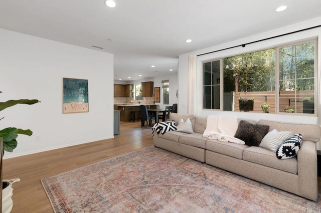 140 Unity Ln, San Marcos, CA 92078 - living room featuring light wood finished floors and recessed lighting