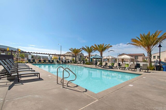 140 Unity Ln, San Marcos, CA 92078 - community pool featuring a patio area, a gazebo, and a residential view