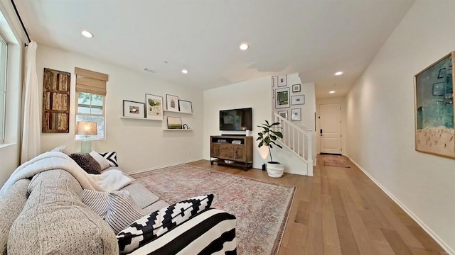 140 Unity Ln, San Marcos, CA 92078 - living room with light wood-style floors, recessed lighting, and stairway