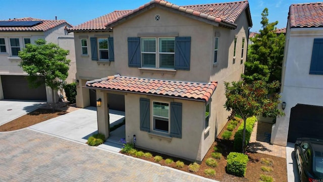 140 Unity Ln, San Marcos, CA 92078 - mediterranean / spanish home with concrete driveway, a tiled roof, stucco siding, and a garage