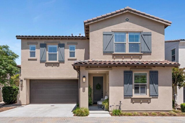 140 Unity Ln, San Marcos, CA 92078 - view of front of home with a tile roof, an attached garage, driveway, and stucco siding