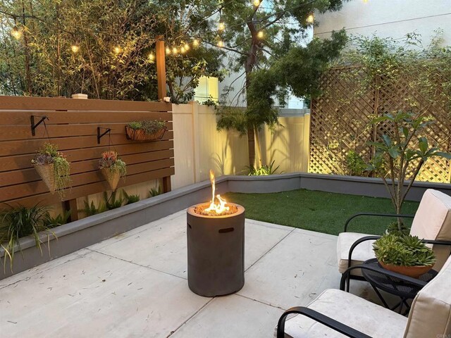 140 Unity Ln, San Marcos, CA 92078 - view of patio with an outdoor fire pit