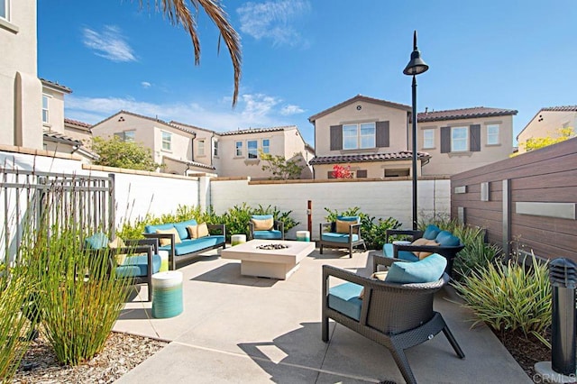 140 Unity Ln, San Marcos, CA 92078 - fenced backyard with an outdoor living space with a fire pit, a patio area, and a residential view
