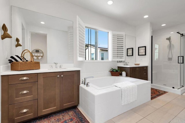 140 Unity Ln, San Marcos, CA 92078 - bathroom featuring a shower stall, a bath, two vanities, recessed lighting, and tile patterned floors