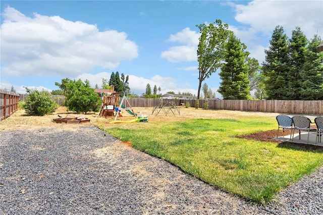 2213 De Mille Rd, Paradise, CA 95969 - fenced backyard with a playground and a patio area