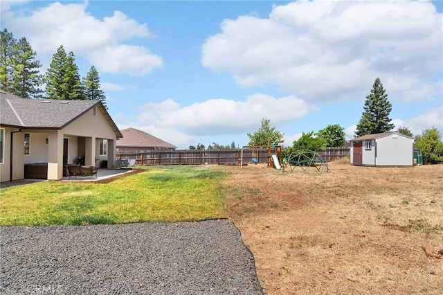 2213 De Mille Rd, Paradise, CA 95969 - fenced backyard featuring a patio, a playground, and a shed