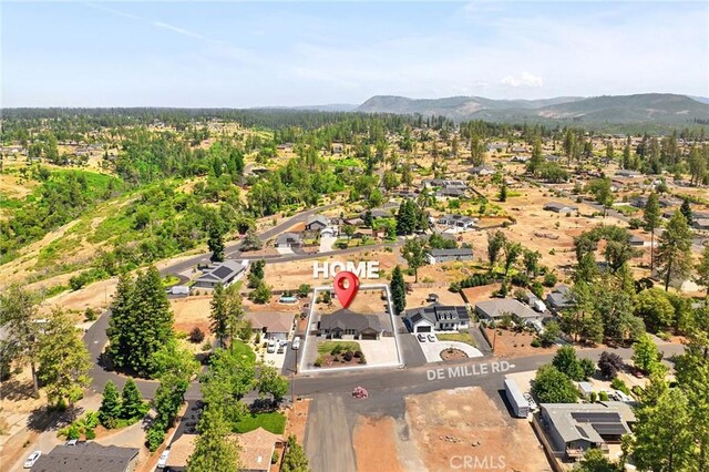 2213 De Mille Rd, Paradise, CA 95969 - aerial view of property and surrounding area with nearby suburban area and a mountainous background
