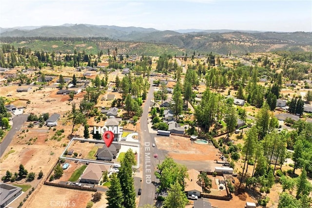 2213 De Mille Rd, Paradise, CA 95969 - aerial overview of property's location with a mountainous background and nearby suburban area