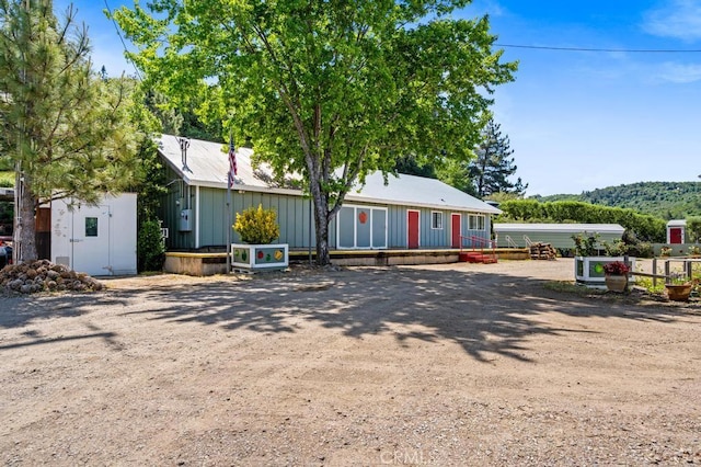 2645 Apple Ln, Julian, CA 92036 - view of front of house with board and batten siding and a storage shed