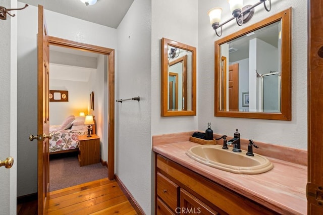 2645 Apple Ln, Julian, CA 92036 - full bathroom featuring vanity, hardwood / wood-style flooring, and connected bathroom