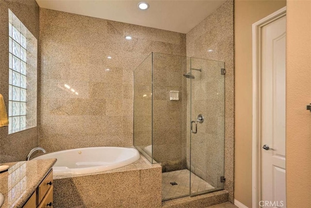 82756 Burnette Dr, Indio, CA 92201 - bathroom featuring a shower stall, a garden tub, vanity, and recessed lighting