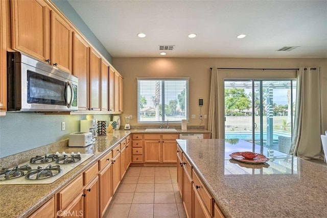 82756 Burnette Dr, Indio, CA 92201 - kitchen featuring white appliances, recessed lighting, light stone countertops, and light tile patterned floors
