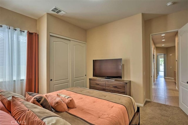 82756 Burnette Dr, Indio, CA 92201 - bedroom featuring light colored carpet, a closet, and light tile patterned floors