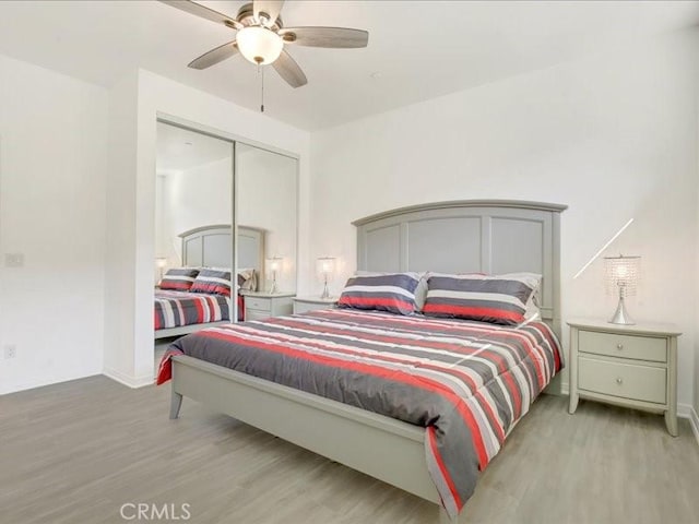 82676 Burnette Dr, Indio, CA 92201 - bedroom featuring wood finished floors, a closet, and a ceiling fan