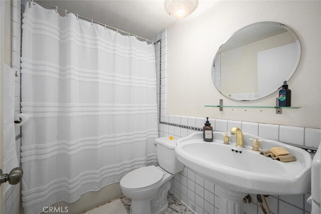 4481 Larwin Ave, Cypress, CA 90630 - full bathroom with tile walls and decorative backsplash