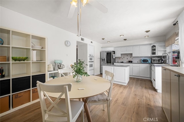 4481 Larwin Ave, Cypress, CA 90630 - dining space with light wood finished floors and ceiling fan