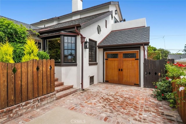615 Seaview St, Laguna Beach, CA 92651 - view of front of home featuring stucco siding, a gate, a garage, and a shingled roof