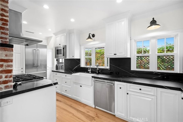 615 Seaview St, Laguna Beach, CA 92651 - kitchen with built in appliances, healthy amount of natural light, dark countertops, white cabinets, and recessed lighting