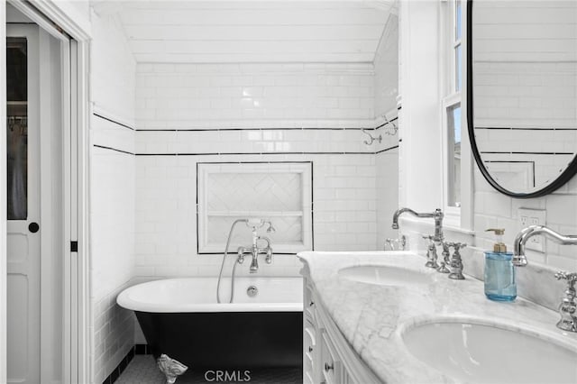615 Seaview St, Laguna Beach, CA 92651 - bathroom featuring double vanity, a freestanding bath, and tile walls