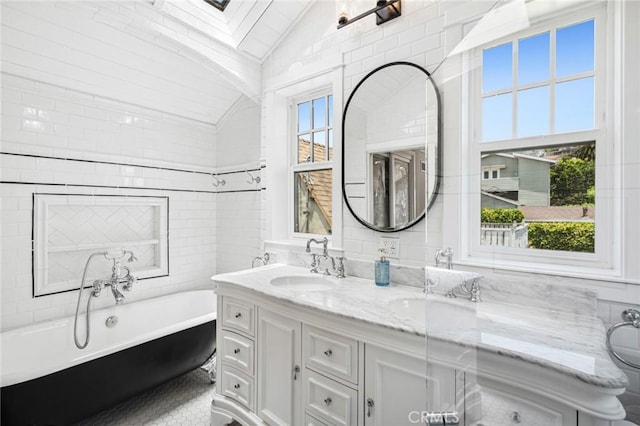 615 Seaview St, Laguna Beach, CA 92651 - full bathroom with a freestanding bath, double vanity, and vaulted ceiling