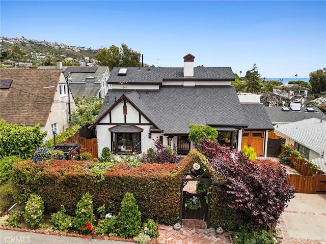 615 Seaview St, Laguna Beach, CA 92651 - tudor home featuring roof with shingles and a chimney