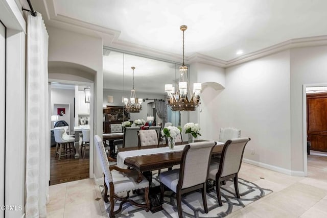 13115 Monarch Palm Ave, Bakersfield, CA 93314 - dining space with a chandelier, light tile patterned floors, ornamental molding, arched walkways, and recessed lighting