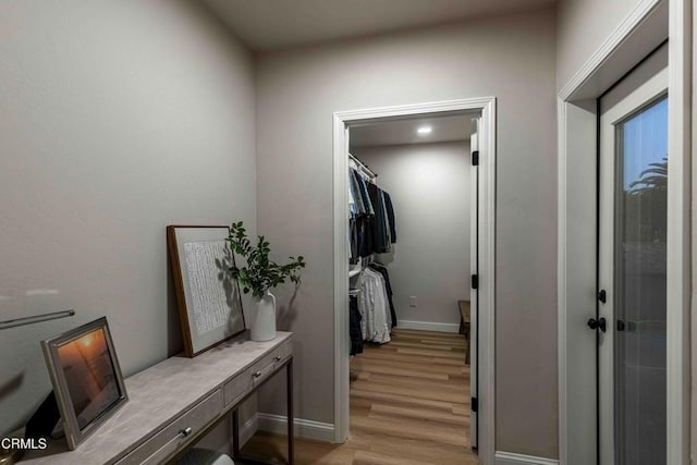 13115 Monarch Palm Ave, Bakersfield, CA 93314 - laundry area featuring light wood-style flooring and a desk