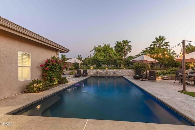 13115 Monarch Palm Ave, Bakersfield, CA 93314 - pool at dusk with a patio