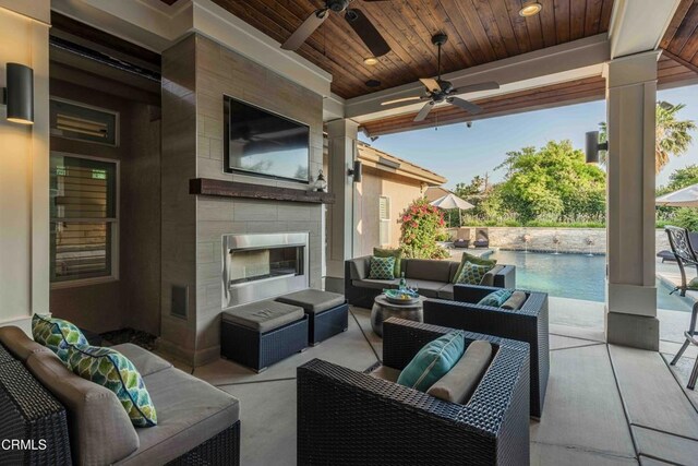 13115 Monarch Palm Ave, Bakersfield, CA 93314 - view of patio / terrace featuring an outdoor living space with a fireplace and ceiling fan