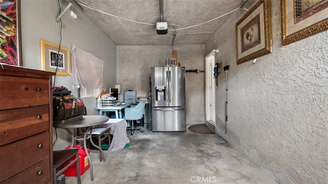 7117 Shadygrove St, Tujunga, CA 91042 - miscellaneous room with concrete flooring and an office area