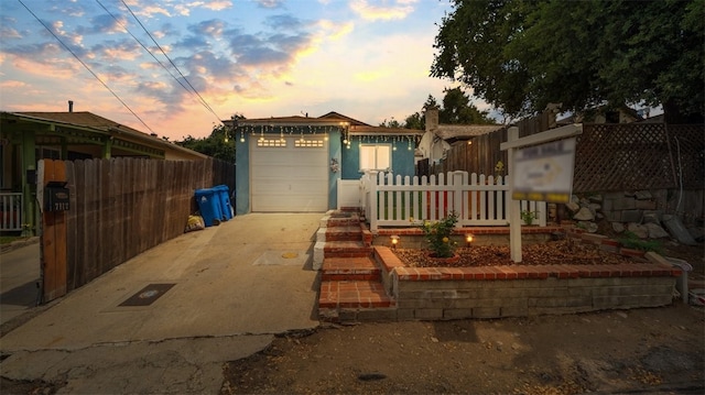 7117 Shadygrove St, Tujunga, CA 91042 - view of front of house with concrete driveway and a garage