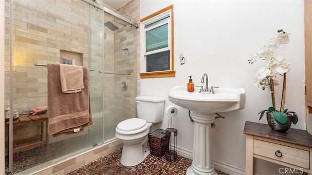 7117 Shadygrove St, Tujunga, CA 91042 - full bathroom featuring toilet and a shower stall