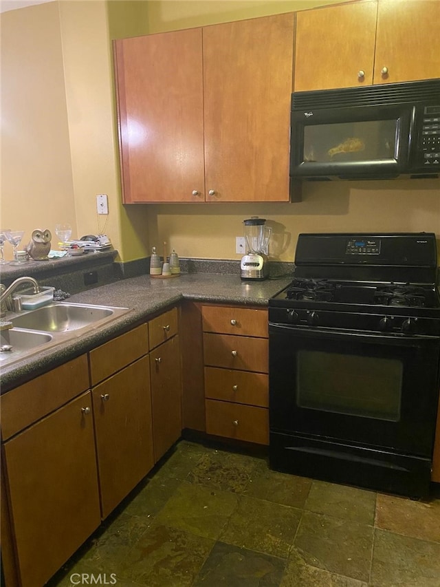 24595 Town Center Dr Unit 3407, Valencia, CA 91355 - kitchen with black appliances, dark stone finish floors, and dark countertops
