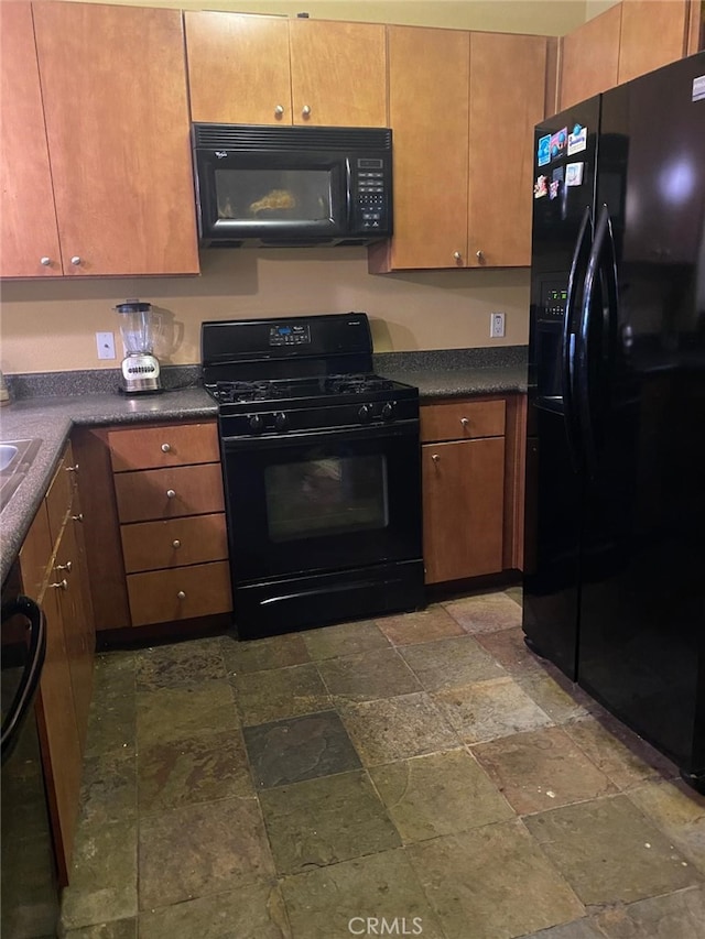 24595 Town Center Dr Unit 3407, Valencia, CA 91355 - kitchen with black appliances, stone finish flooring, and dark countertops