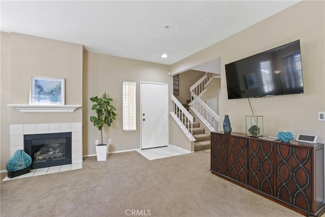 259 Gallery Way, Tustin, CA 92782 - foyer entrance featuring carpet floors, stairs, recessed lighting, and a tile fireplace