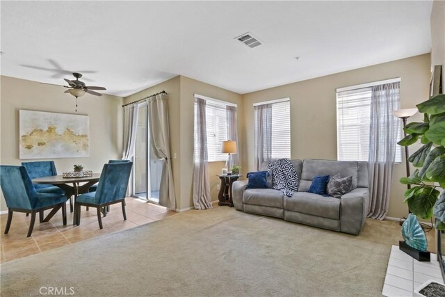 259 Gallery Way, Tustin, CA 92782 - carpeted living room with ceiling fan and tile patterned flooring