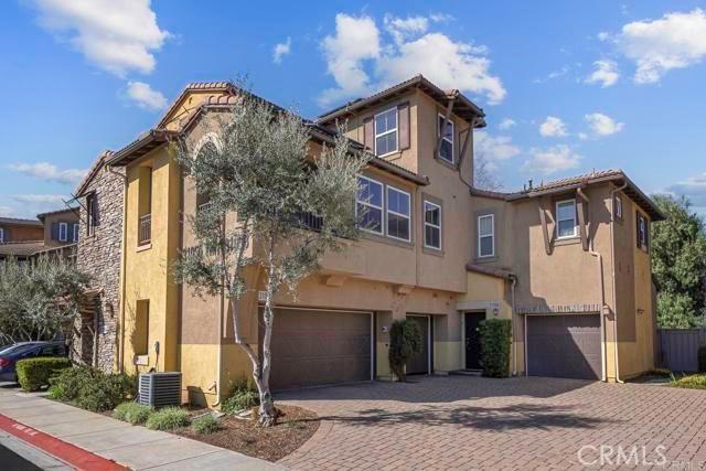 31054 Strawberry Tree Ln Unit 5, Temecula, CA 92592 - view of property featuring a garage and driveway