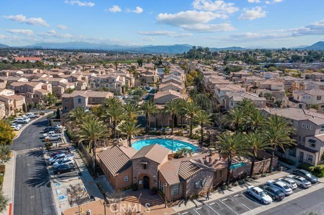 31054 Strawberry Tree Ln Unit 5, Temecula, CA 92592 - aerial view of residential area with a mountain backdrop and a pool area