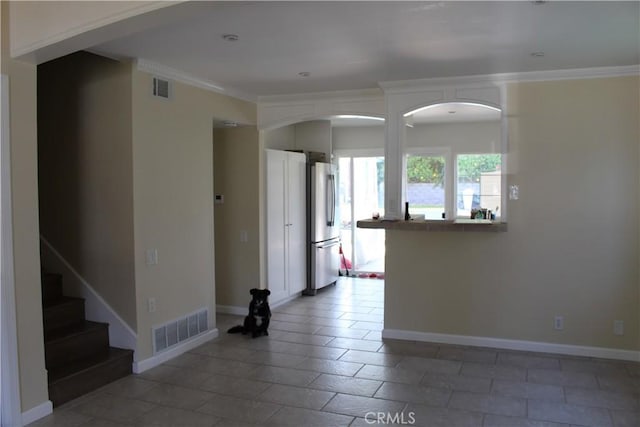 23266 Via Ronda, Mission Viejo, CA 92691 - empty room with ornamental molding, stairs, and arched walkways