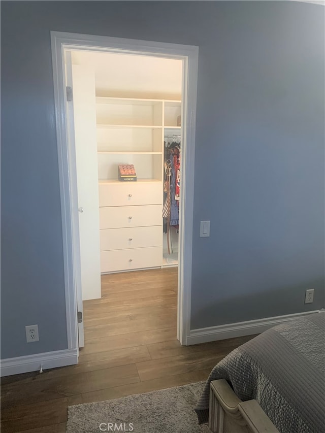 23266 Via Ronda, Mission Viejo, CA 92691 - bedroom with a walk in closet, wood finished floors, and a closet