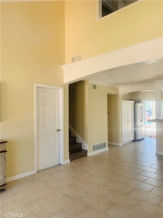 23266 Via Ronda, Mission Viejo, CA 92691 - empty room with a towering ceiling and stairway