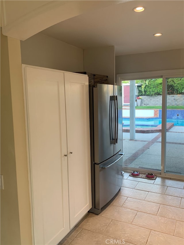 23266 Via Ronda, Mission Viejo, CA 92691 - kitchen with freestanding refrigerator, recessed lighting, and white cabinetry